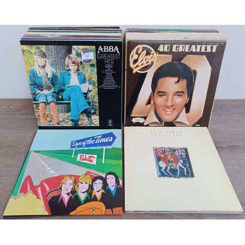 612 - A collection of LP vinyl records to include The Supremes, John Lennon, Paul McCartney, The Jumping J... 