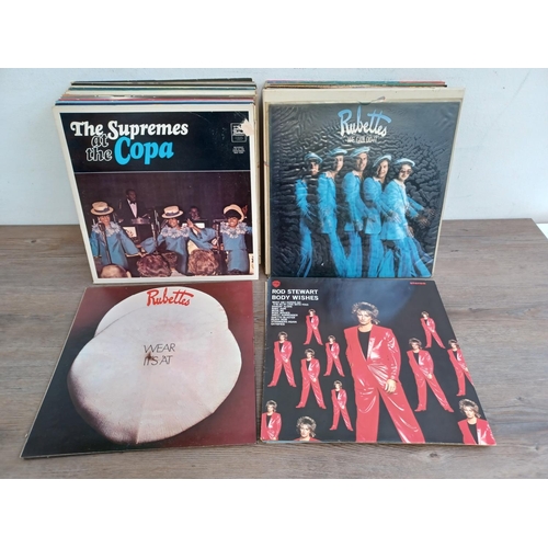 612 - A collection of LP vinyl records to include The Supremes, John Lennon, Paul McCartney, The Jumping J... 