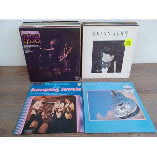 612 - A collection of LP vinyl records to include The Supremes, John Lennon, Paul McCartney, The Jumping J... 