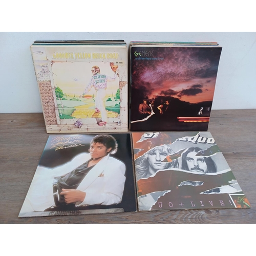 612 - A collection of LP vinyl records to include The Supremes, John Lennon, Paul McCartney, The Jumping J... 