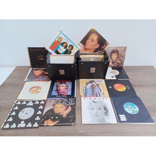 614 - Two record cases containing a collection of 7