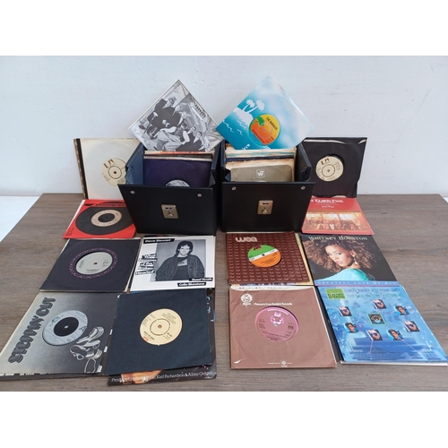 614 - Two record cases containing a collection of 7