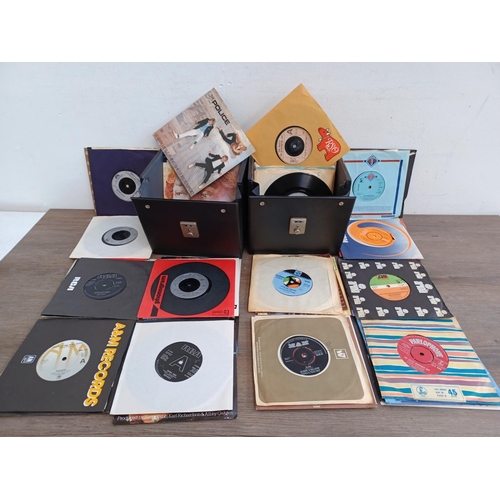 614 - Two record cases containing a collection of 7