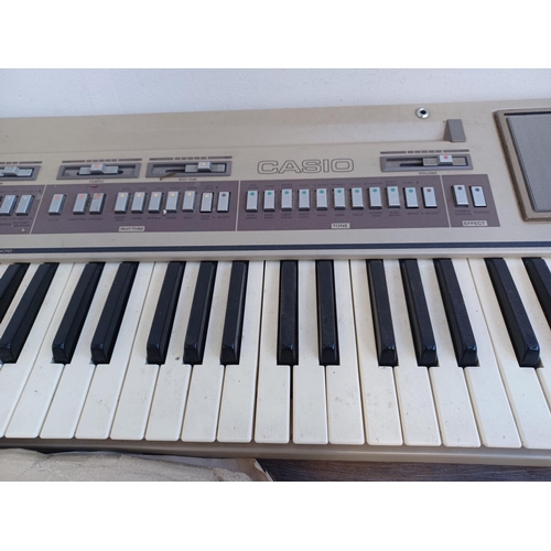 620 - Two items, one collection of vintage and antique sheet music and one early 1980s Casio Casiotone 610... 