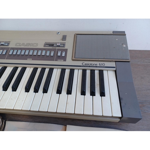 620 - Two items, one collection of vintage and antique sheet music and one early 1980s Casio Casiotone 610... 