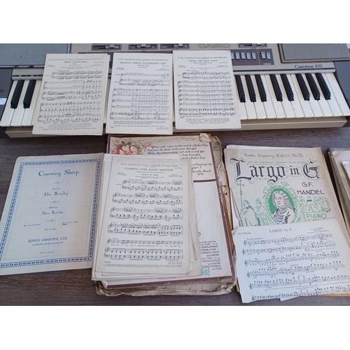 620 - Two items, one collection of vintage and antique sheet music and one early 1980s Casio Casiotone 610... 