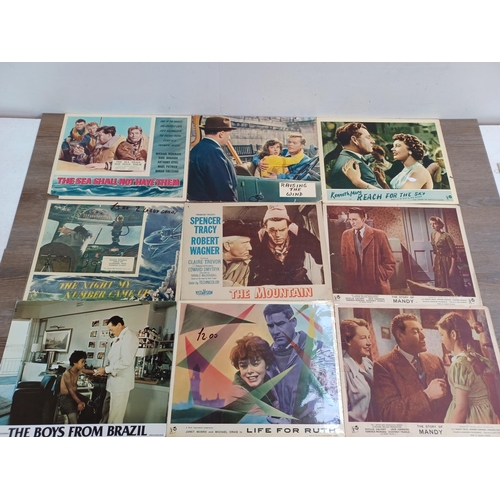 634 - A collection of lobby cards to include Svengali, A Town Like Alice, To Paris With Love, The Titfield... 