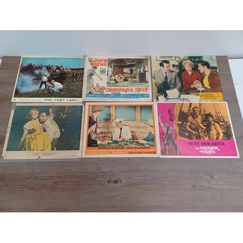 635 - A collection of lobby cards to include Gone With The Wind, The Long Arm, Yesterday's Enemy, The Fast... 