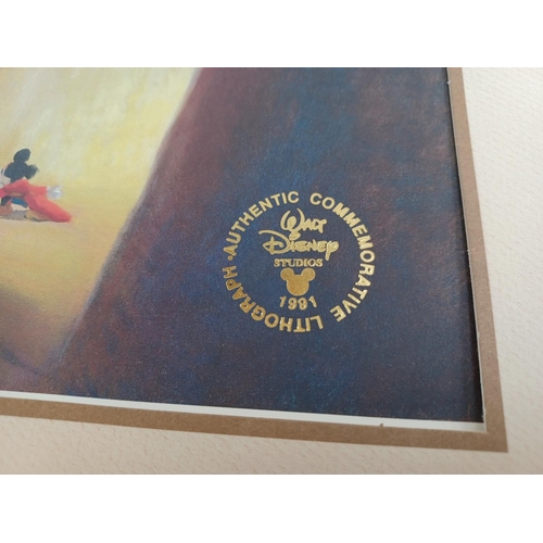 638 - A collection of film memorabilia to include Walt Disney's Fantasia commemorative book and lithograph... 