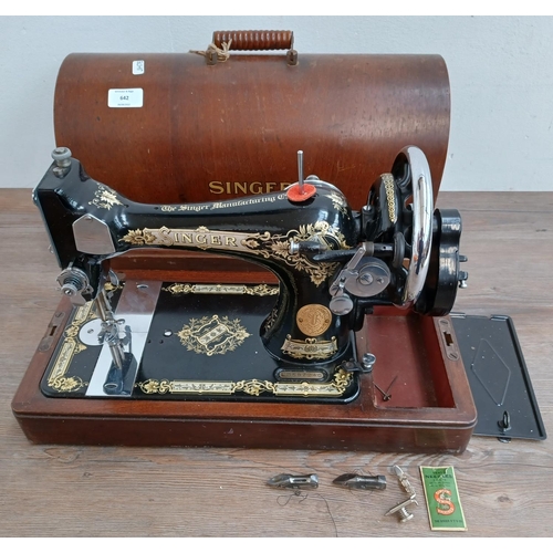 642 - A cased Singer hand crank sewing machine (serial no. EB587240)