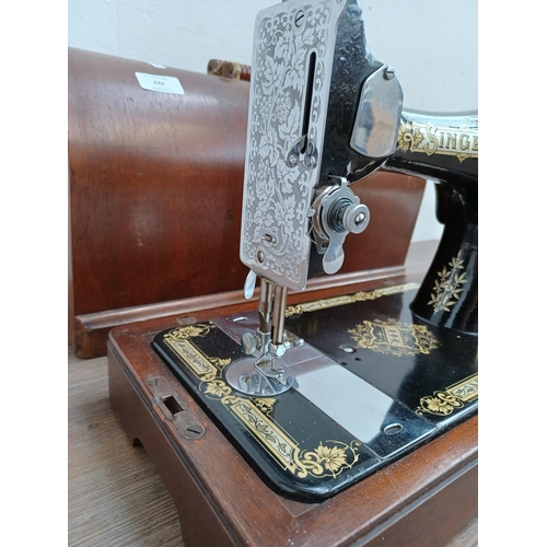 642 - A cased Singer hand crank sewing machine (serial no. EB587240)