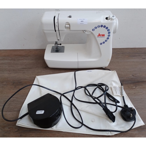 643 - A Jenome Jem electric sewing machine with foot pedal, power cable and cover