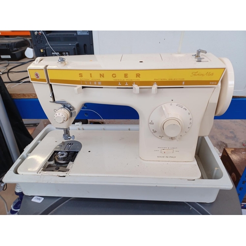 648 - Two items, one cased Singer Fashion Mate 360 electric sewing machine and one electric wood burning s... 