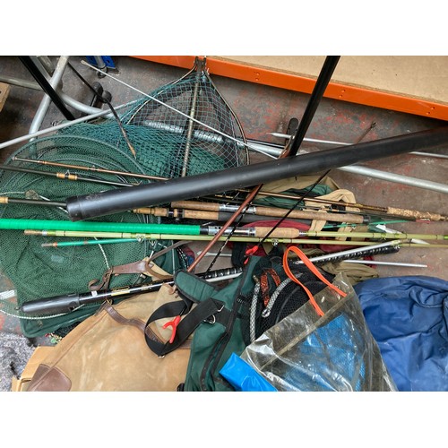 699 - A large collection of assorted fishing tackle to include terminal tackle, nets, rod rests etc.