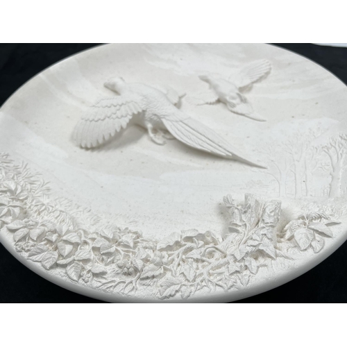 102 - A 1959 Bossons Pheasants unpainted circular chalkware wall plaque with certificate of authenticity -... 