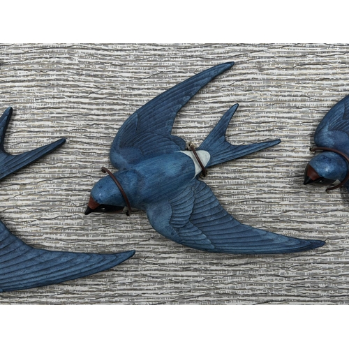 112 - A set of three Bossons pottery Swallows on original cardboard display panel - approx. 18cm high x 42... 