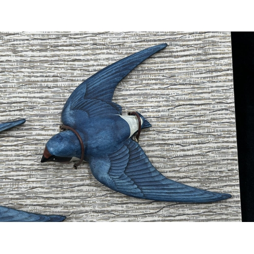 112 - A set of three Bossons pottery Swallows on original cardboard display panel - approx. 18cm high x 42... 