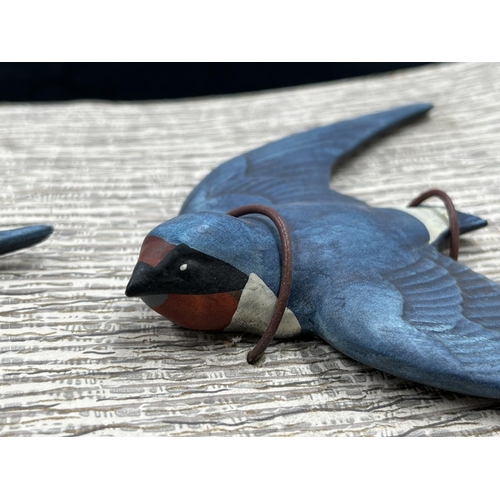 112 - A set of three Bossons pottery Swallows on original cardboard display panel - approx. 18cm high x 42... 