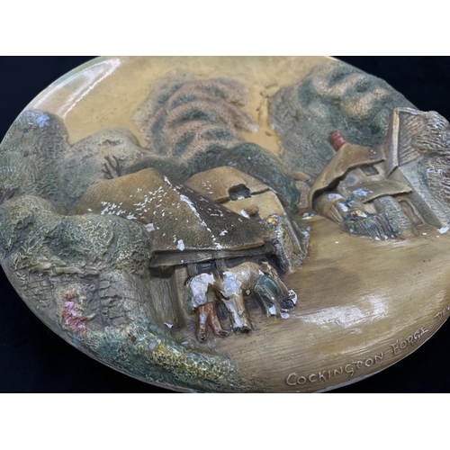 135 - An early Bossons Cockington Forge, Devon chalkware circular wall plaque - approx. 36cm diameter