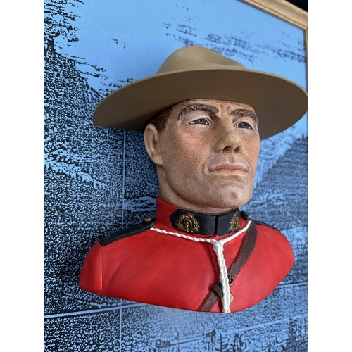 19 - A Bossons Royal Canadian Mountain Policeman chalkware head wall mask with original display panel