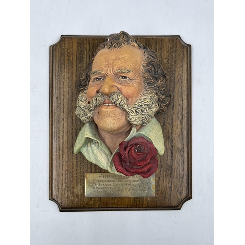 2 - A Bossons Harry Wheatcroft sample chalkware head wall mask on oak plinth with engraving 'A replica a... 