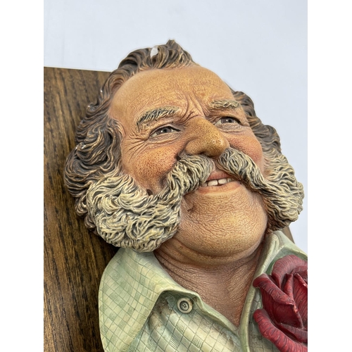 2 - A Bossons Harry Wheatcroft sample chalkware head wall mask on oak plinth with engraving 'A replica a... 