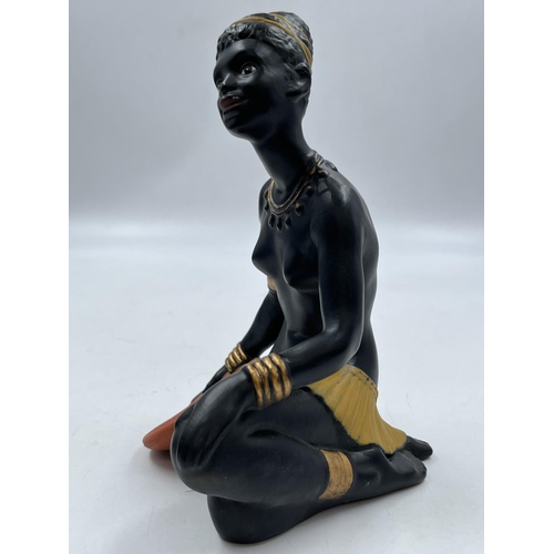 23 - A Bossons African group three piece ceramic figurine set comprising Father, Mother and Boy - father ... 