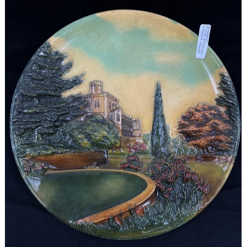 25 - A 1955 Bossons Old English Manor House chalkware circular wall plaque - approx. 36.5cm diameter