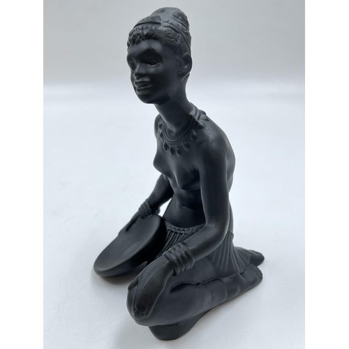 65 - A boxed Bossons African black painted pottery figurine of an African Lady - measuring approx. 19cm h... 