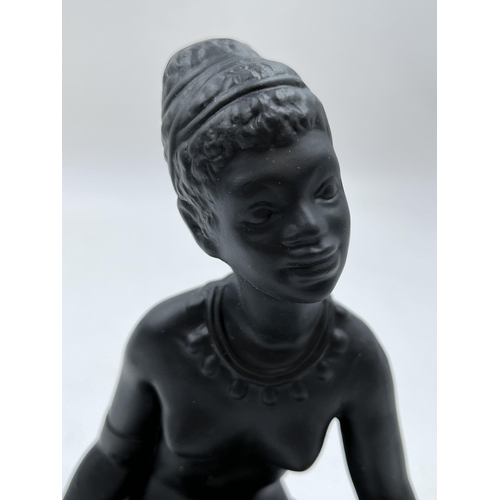 65 - A boxed Bossons African black painted pottery figurine of an African Lady - measuring approx. 19cm h... 