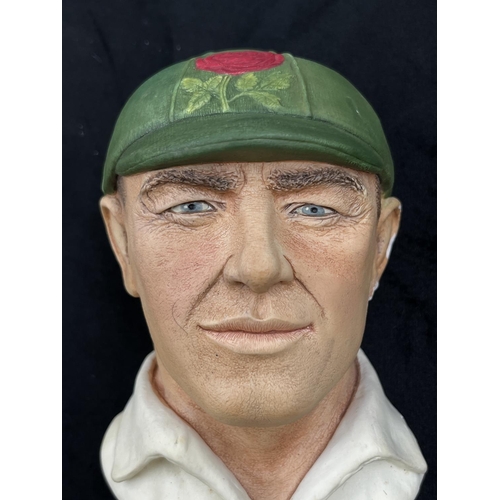 74 - A 1995 Bossons Cricketer dark green cap with red rose version chalkware head wall mask - approx. 16c... 