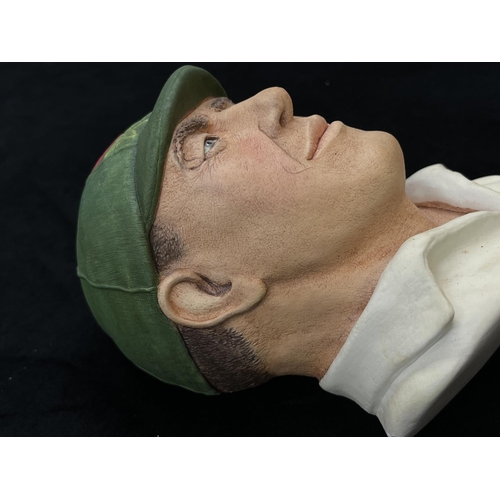 74 - A 1995 Bossons Cricketer dark green cap with red rose version chalkware head wall mask - approx. 16c... 