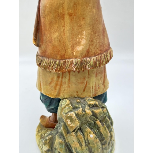 91 - A Bossons Afghan with blue belt chalkware shelf ornament figurine, specially painted to be displayed... 