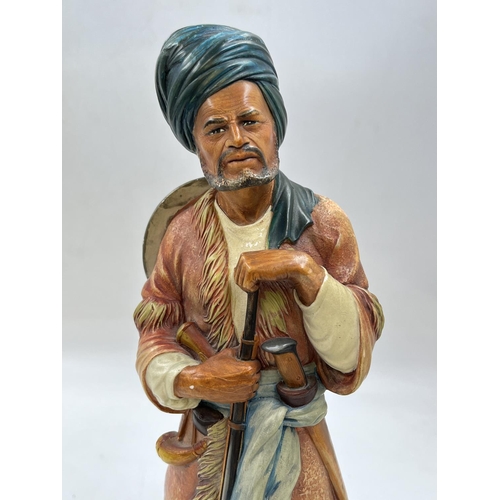 91 - A Bossons Afghan with blue belt chalkware shelf ornament figurine, specially painted to be displayed... 