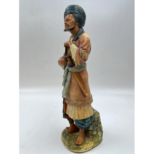 91 - A Bossons Afghan with blue belt chalkware shelf ornament figurine, specially painted to be displayed... 