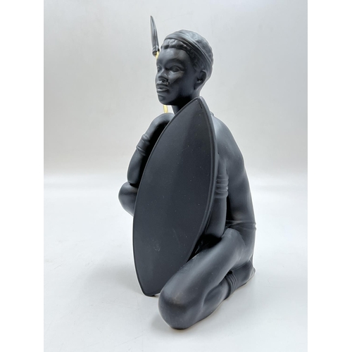 95 - A boxed Bossons African Man black painted pottery figurine - approx. 26cm high