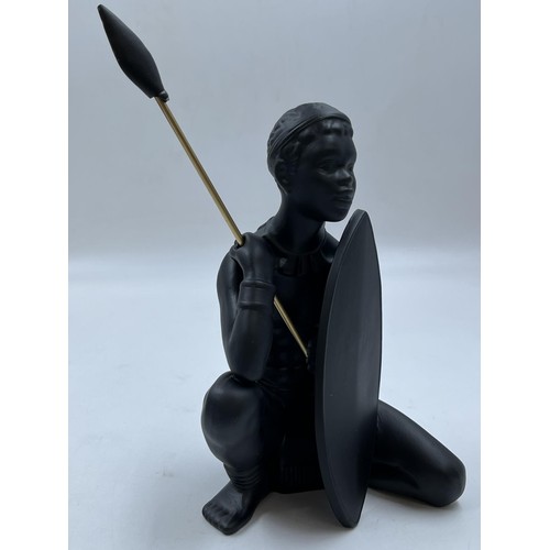 65A - A boxed Bossons African black painted pottery figurine of an African Man - measuring approx. 26cm hi... 