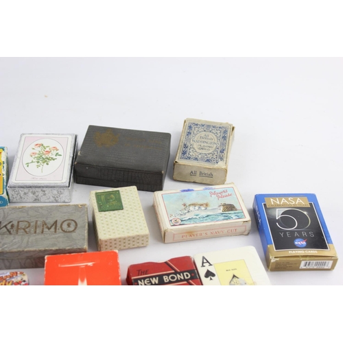 108 - A collection of assorted playing cards and card games to include Happy Families etc.