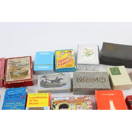 108 - A collection of assorted playing cards and card games to include Happy Families etc.