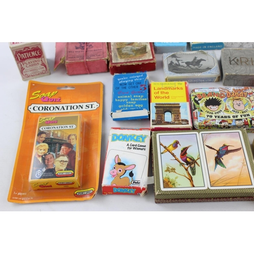 108 - A collection of assorted playing cards and card games to include Happy Families etc.