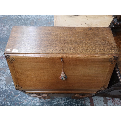 351 - A mid 20th century carved oak bureau with three drawers, fall front and baluster supports - approx. ... 