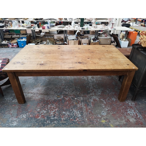 355 - A solid pine rectangular farmhouse dining table - approx. 78cm high x 120cm wide x 213cm long