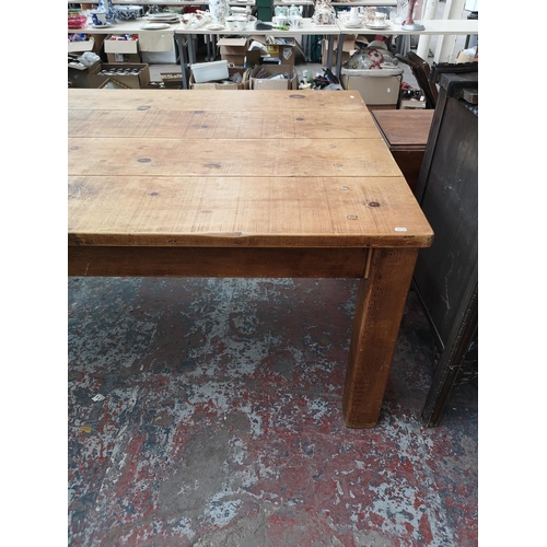 355 - A solid pine rectangular farmhouse dining table - approx. 78cm high x 120cm wide x 213cm long