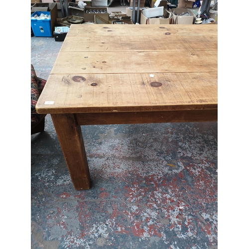 355 - A solid pine rectangular farmhouse dining table - approx. 78cm high x 120cm wide x 213cm long