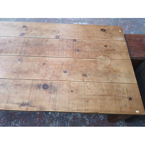 355 - A solid pine rectangular farmhouse dining table - approx. 78cm high x 120cm wide x 213cm long