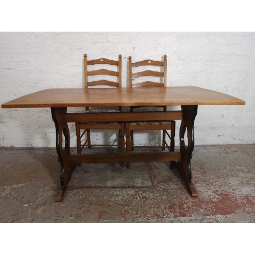 369 - An oak rectangular dining table and six ladder back dining chairs - table approx. 73cm high x 83cm w... 