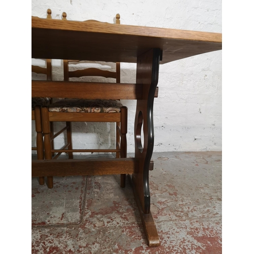 369 - An oak rectangular dining table and six ladder back dining chairs - table approx. 73cm high x 83cm w... 