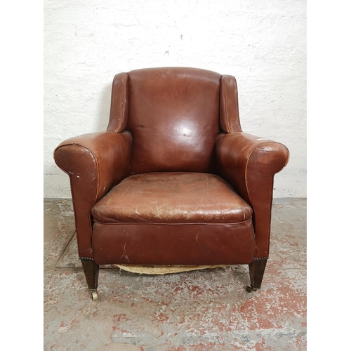 376 - An early/mid 20th century brown leather armchair - approx. 89cm high x 79cm wide x 76cm deep