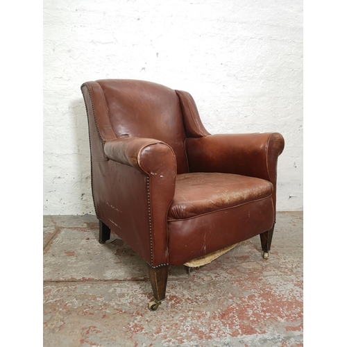 376 - An early/mid 20th century brown leather armchair - approx. 89cm high x 79cm wide x 76cm deep