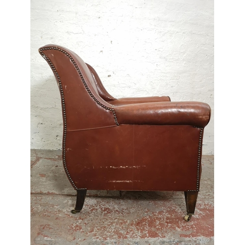 376 - An early/mid 20th century brown leather armchair - approx. 89cm high x 79cm wide x 76cm deep